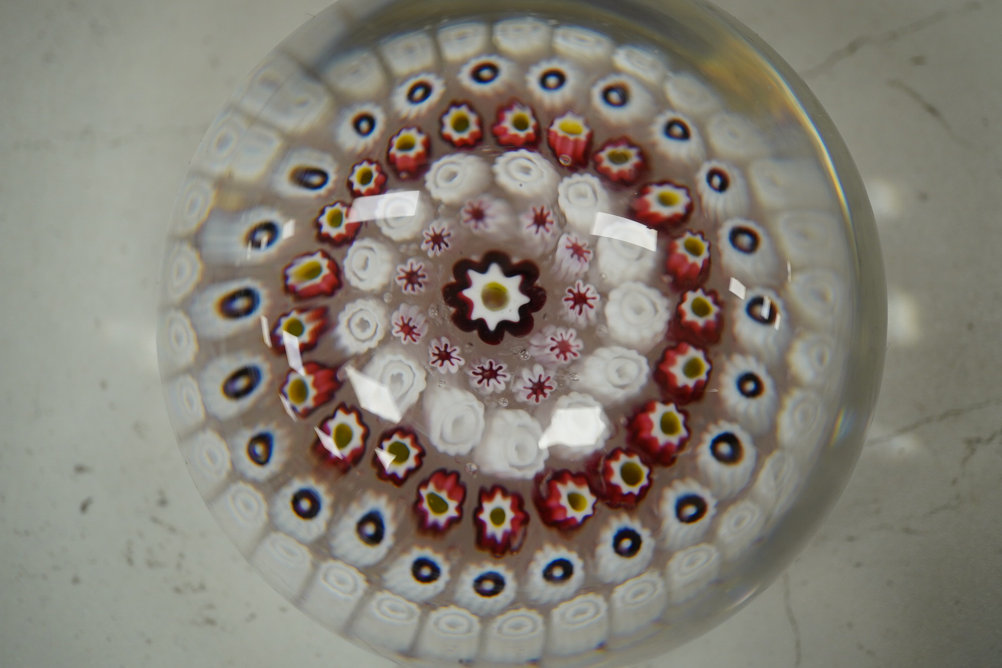 Two Victorian English millefiori glass paperweights, 7cm tall. Condition - fair to good